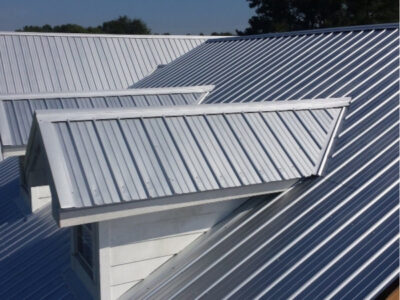 Ann Arbor MI 41 Close up view of a silver metal roof with dormers installed by a metal roofing contractor near Ann Arbor, Michigan