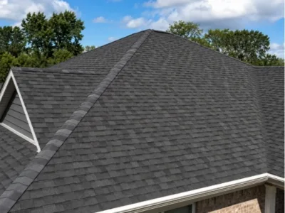 Adrian MI 40 Close up view of a hip roof with dark asphalt shingles installed by a roofing contractor in Adrian, Michigan