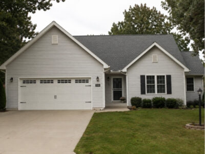 Adrian MI 39 Front view of a home with a new asphalt shingle roof in Adrian, Michigan